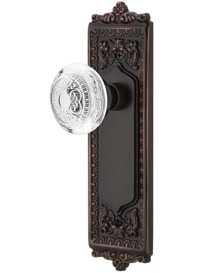 Egg and Dart Door Set with Matching Crystal-Glass Knobs in Timeless Bronze.